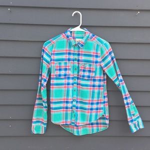 a plaid flannel button up